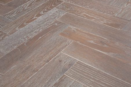 Grey brown engineered wood flooring oak parquet herringbone with brushed surface finished with white oil in Surrey