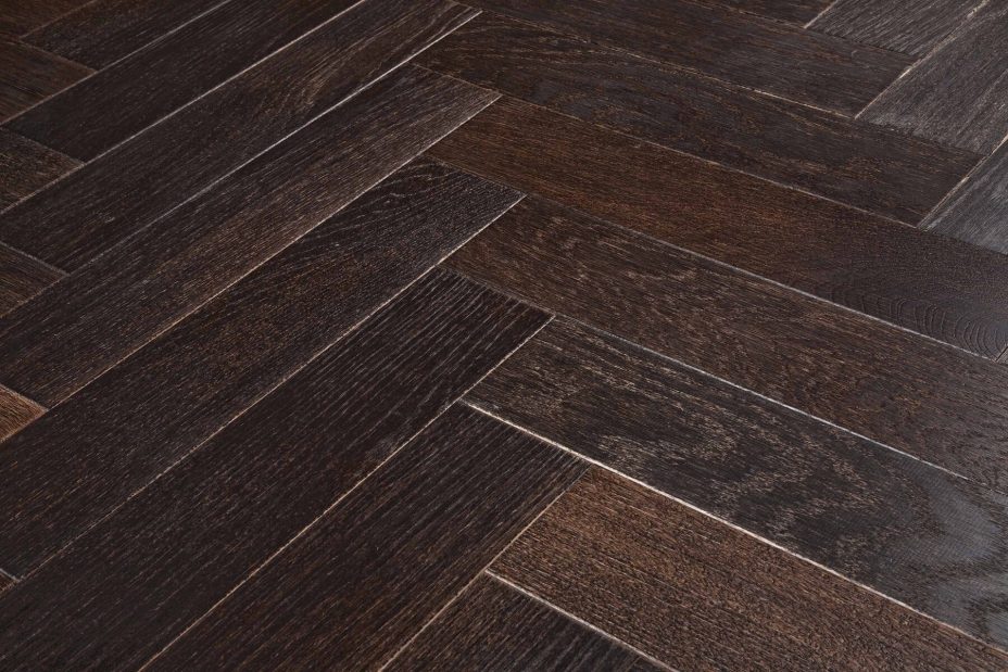 Dark brown engineered wood flooring oak parquet herringbone with brushed surface finished with oil in Surrey