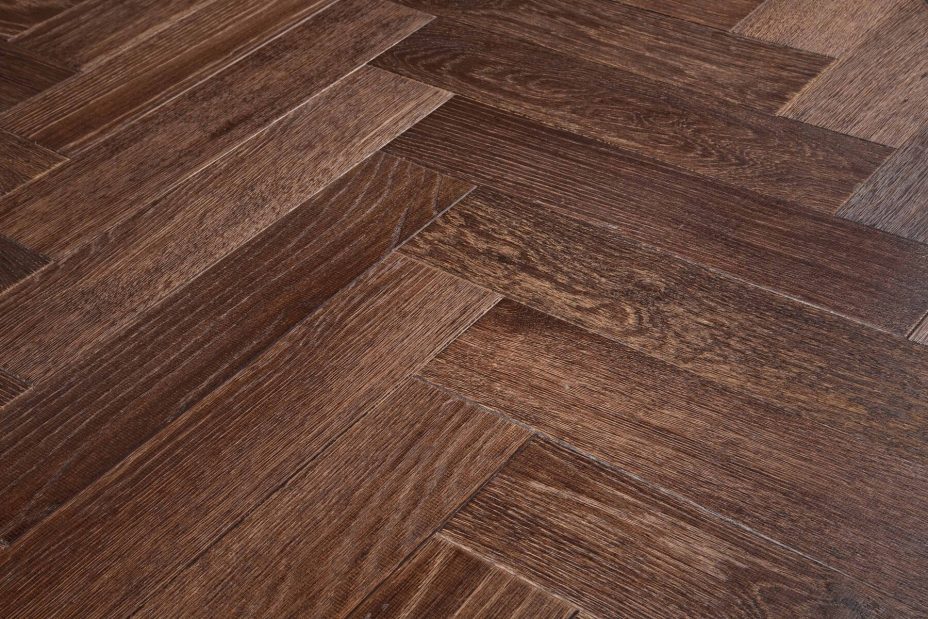 Brown engineered wood flooring oak parquet herringbone with brushed surface finished with oil in Surrey