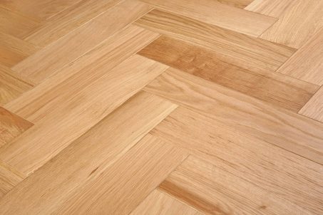 Light brown engineered wood flooring oak parquet herringbone with brushed surface finished with oil in Surrey