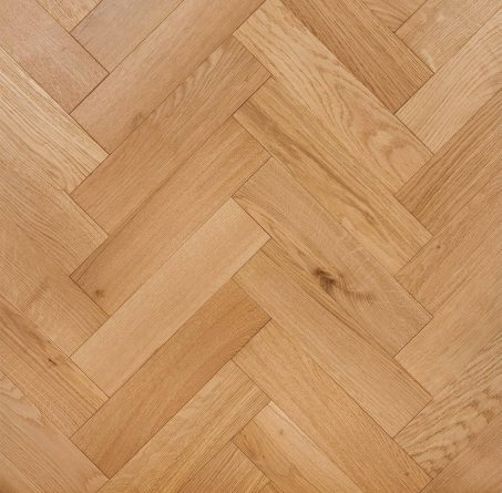 Light brown engineered wood flooring oak parquet herringbone with brushed surface finished with lacquer in Surrey