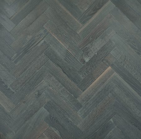 Grey solid oak parquet herringbone wood flooring distressed and aged finished with grey natural oil in Surrey