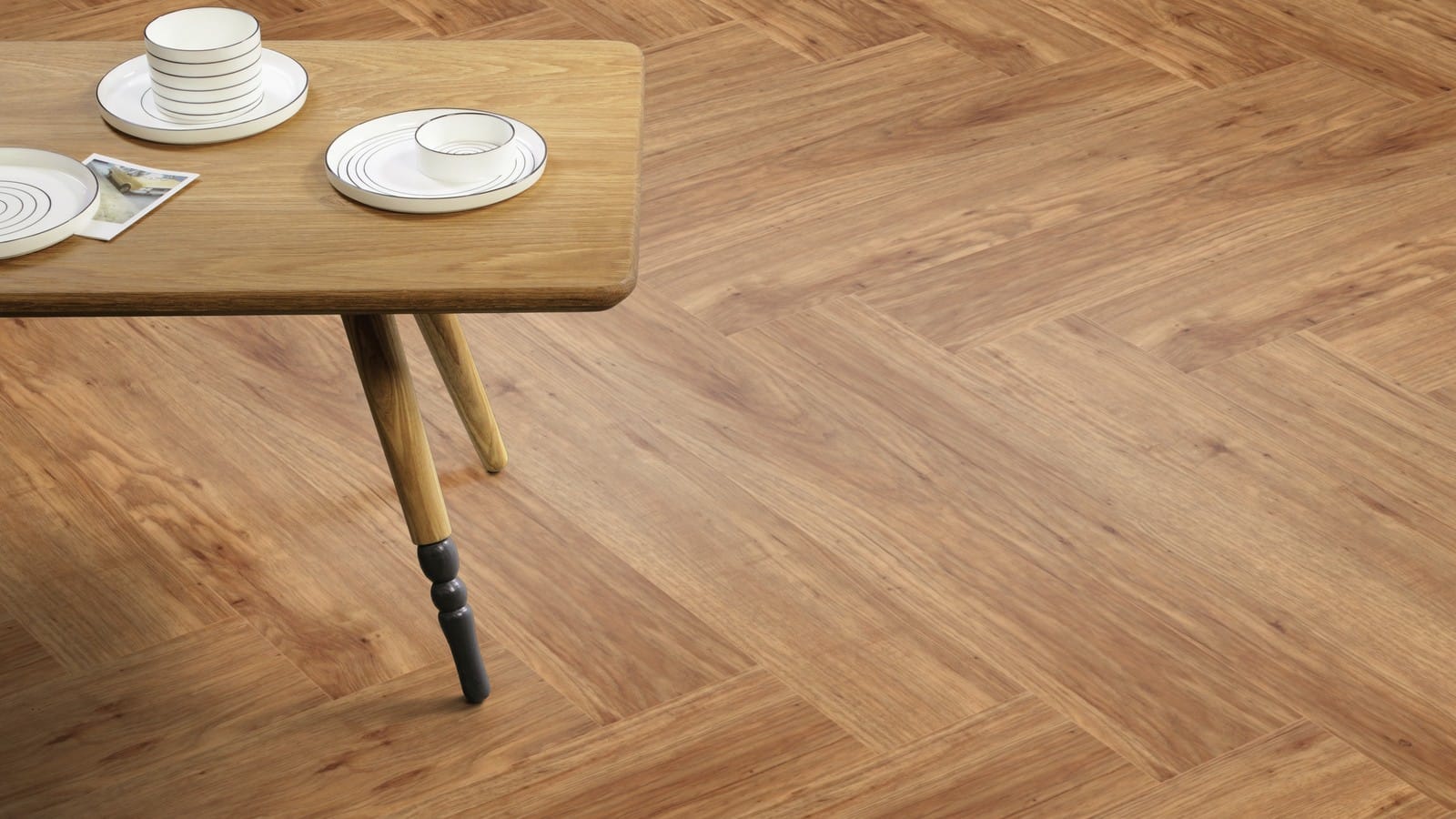 The Herringbone Plank design of Grande Pecan luxury vinyl tile by Amtico
