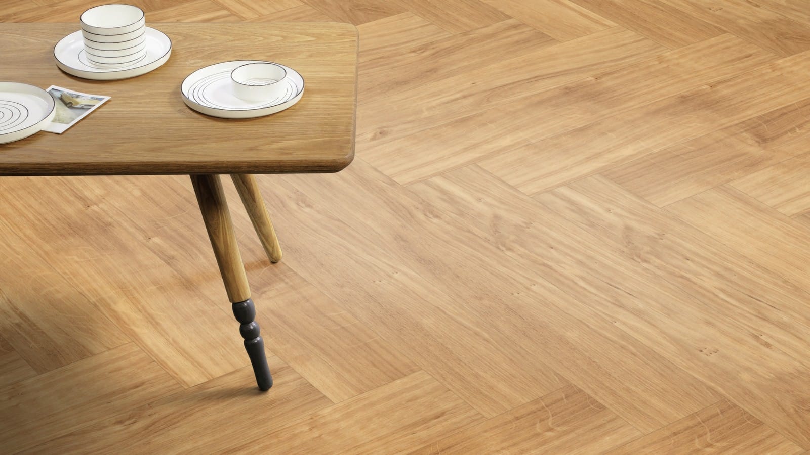 The Herringbone Plank design of Golden Oak luxury vinyl tile by Amtico