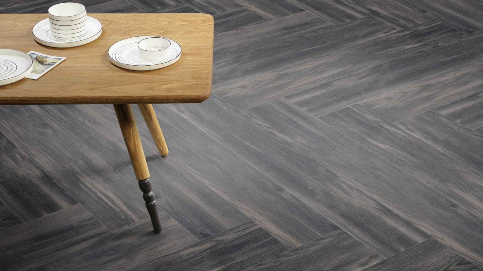 The Herringbone Plank design of Lunar Pine luxury vinyl tile by Amtico