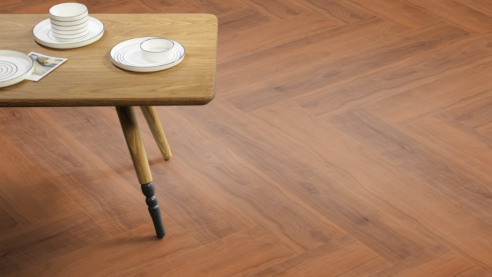 The Herringbone Plank design of Ashdown Plum luxury vinyl tile by Amtico