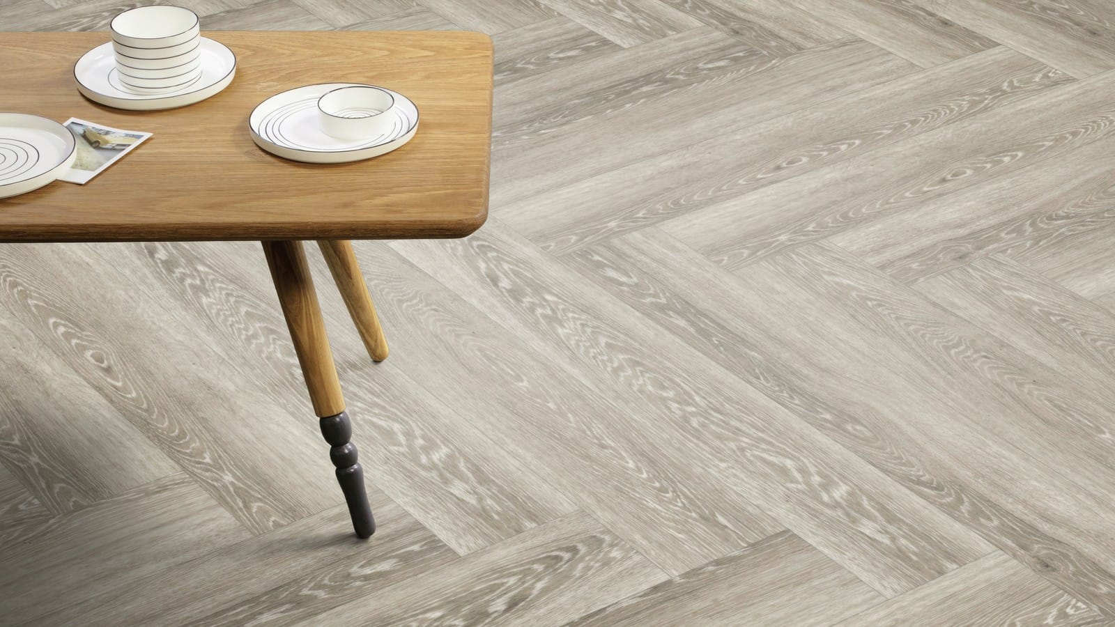 The Herringbone Plank design of Limed Grey Wood luxury vinyl tile by Amtico