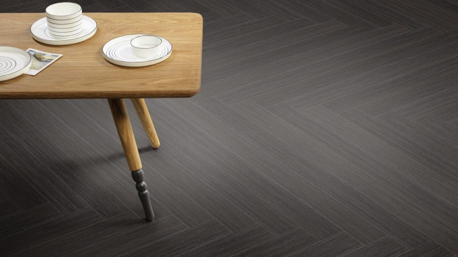 The Herringbone Plank design of Back to Black Vamp luxury vinyl tile by Amtico