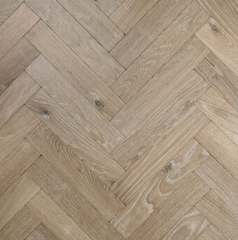 Solid oak herringbone wood flooring named Cathedral Alabaster