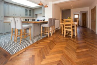 Brown engineered parquet wood flooring herringbone select oak finished with lacquer in Surrey