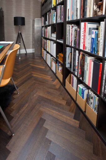 Dark brown engineered parquet wood flooring herringbone select oak finished with lacquer in Surrey