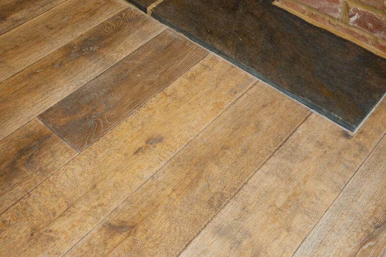 Distressed engineered oak wood flooring country grade 190mm wide with splits and character finished with natural oil in Surrey