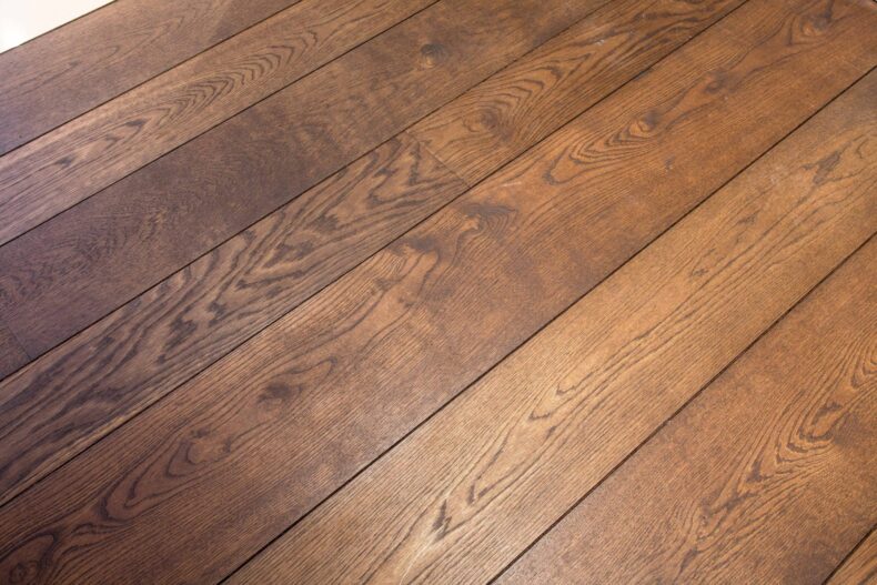Dark brown engineered oak wood flooring classic grade in three widths 140mm 180mm 220mm wide fumed and finished with natural dark oil in Surrey