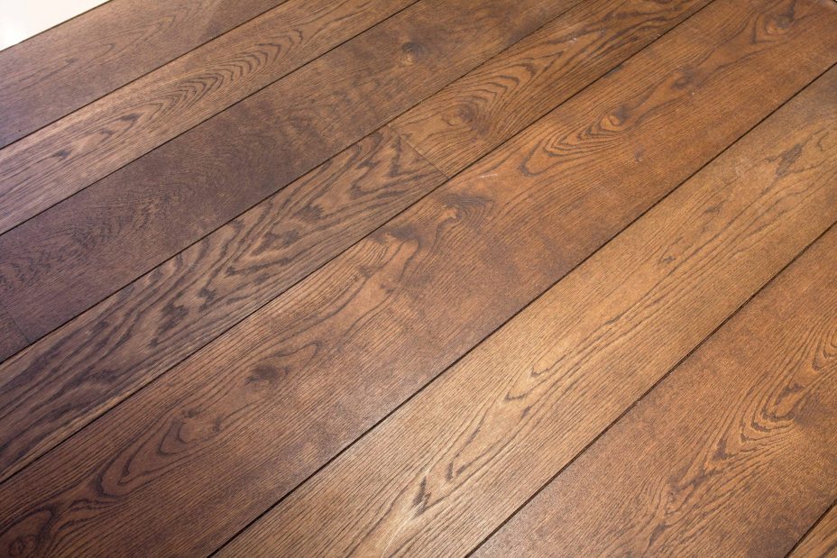 Dark brown engineered oak wood flooring classic grade in three widths 140mm 180mm 220mm wide fumed and finished with natural dark oil in Surrey