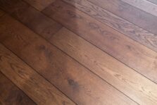 Dark brown engineered oak wood flooring classic grade in three widths 140mm 180mm 220mm wide fumed and finished with natural dark oil in Surrey