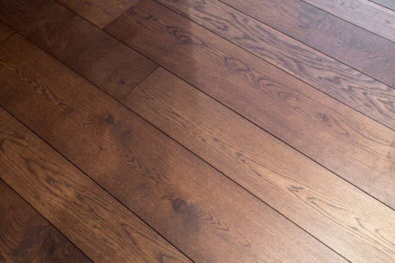Dark brown engineered oak wood flooring classic grade in three widths 140mm 180mm 220mm wide fumed and finished with natural dark oil in Surrey