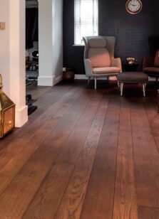 Dark brown engineered oak wood flooring classic grade in three widths 140mm 180mm 220mm wide fumed and finished with natural dark oil in Surrey