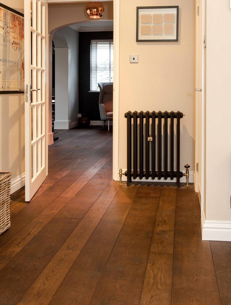 Dark brown engineered oak wood flooring classic grade in three widths 140mm 180mm 220mm wide fumed and finished with natural dark oil in Surrey
