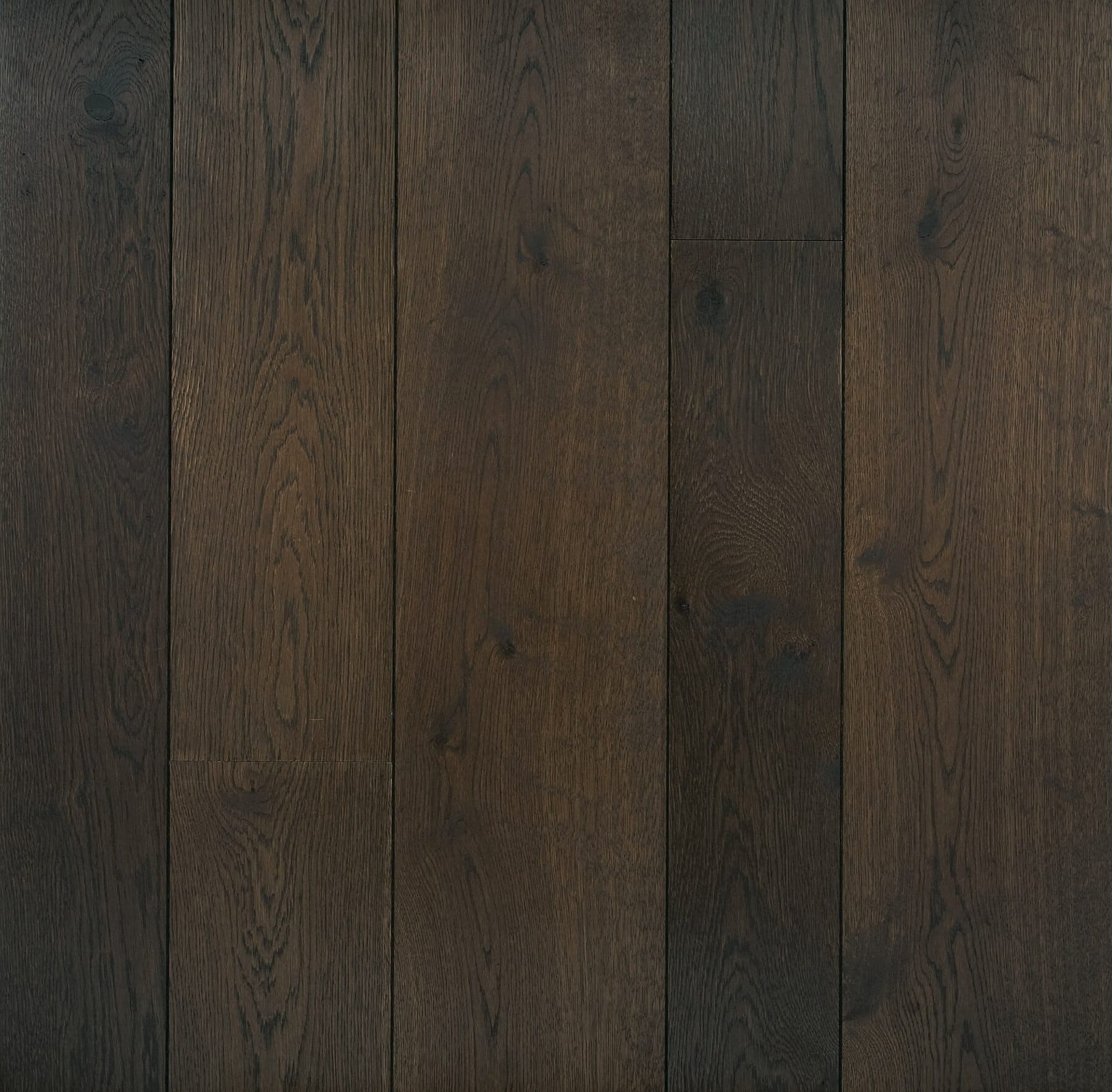 Dark brown engineered oak wood flooring classic grade in three widths 140mm 180mm 220mm wide fumed and finished with natural dark oil in Surrey