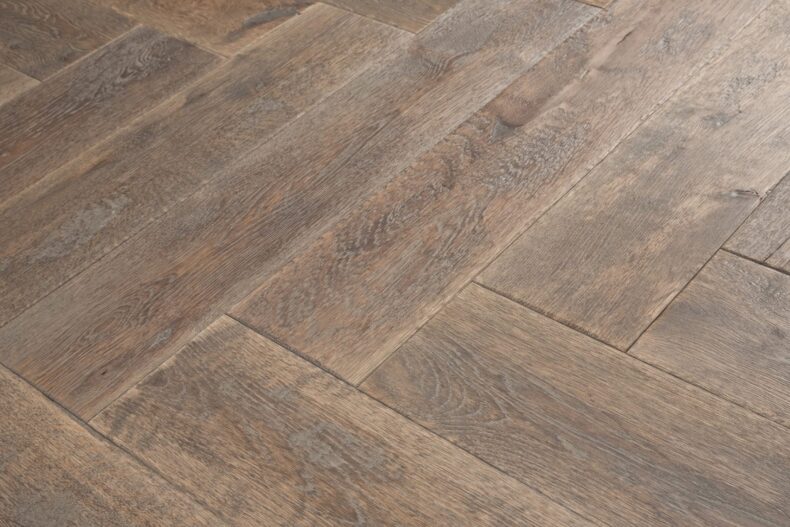 Distressed light grey engineered oak wood flooring country grade 190mm wide with splits and character finished with natural oil in Surrey
