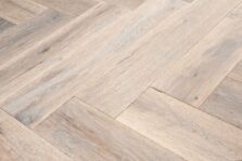 Distressed light grey engineered oak wood flooring country grade 190mm wide with splits and character finished with natural oil in Surrey