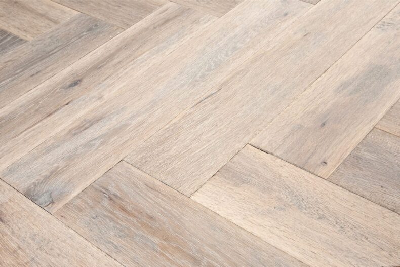 Distressed light grey engineered oak wood flooring country grade 190mm wide with splits and character finished with natural oil in Surrey