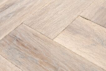 Distressed light grey engineered oak wood flooring country grade 190mm wide with splits and character finished with natural oil in Surrey