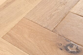 Distressed light grey engineered oak wood flooring country grade 190mm wide with splits and character finished with natural oil in Surrey