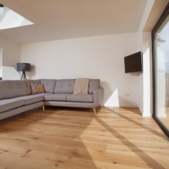 Grey brown engineered wood flooring 190mm wide rustic grade oak with brushed surface finished with natural oil in Surrey