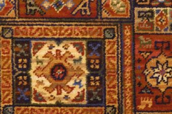 Glenavy Ethnic Panel Rust carpet by Ulster Carpets