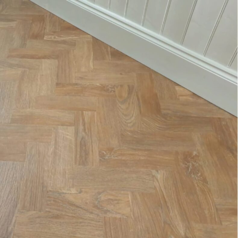 View of Spring Oak - Parquet luxury vinyl tile by Harvey Maria