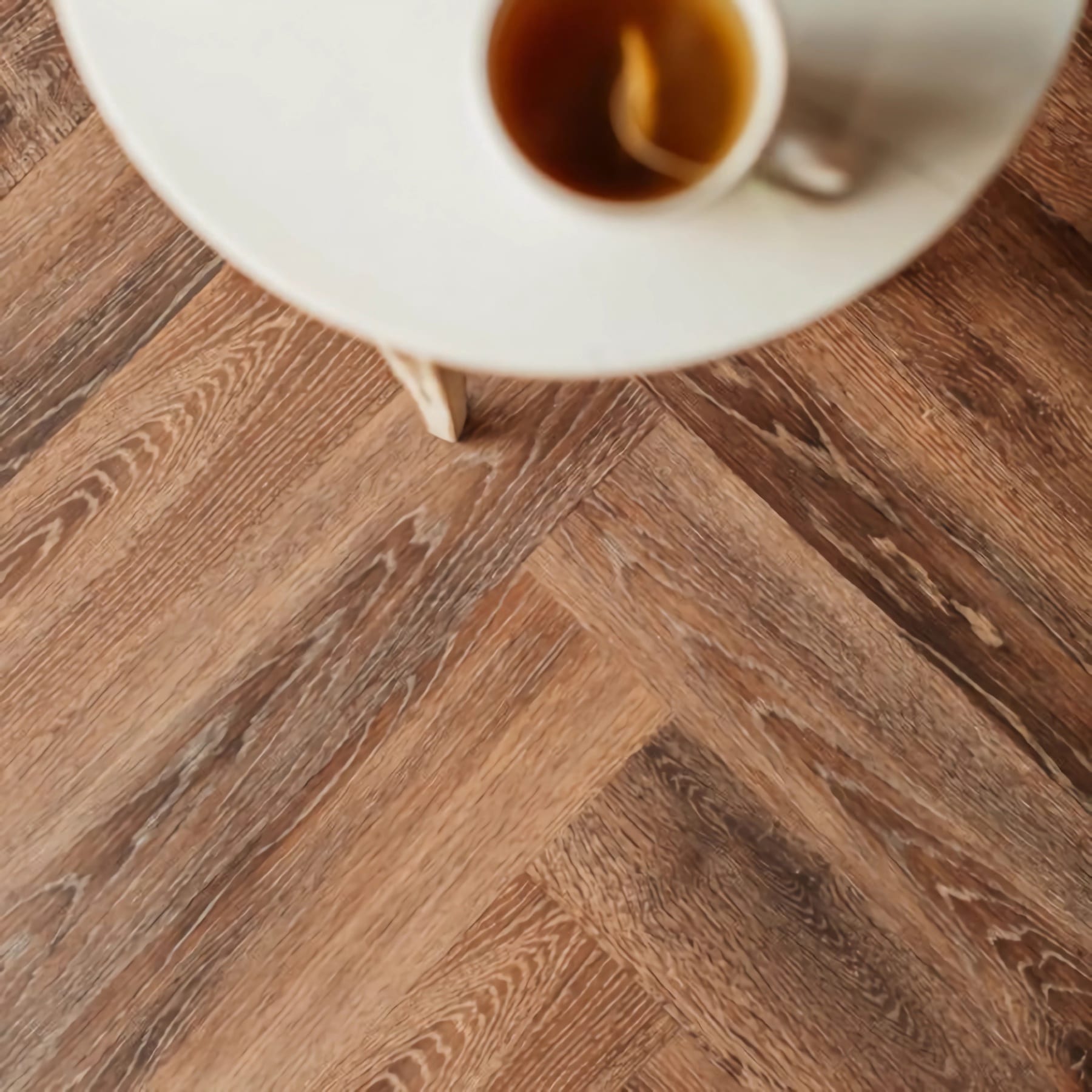 View of Toasted Oak - Herringbone luxury vinyl tile by Harvey Maria