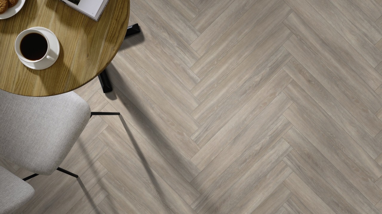 The Herringbone Plank design of Ashdown Oak luxury vinyl tile by Amtico