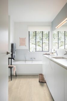 View of Sea Breeze Oak Beige AVMPU40080 luxury vinyl tile by Quick-Step Livyn