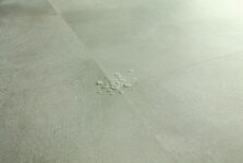 View of Soft Sage AVMTU40334 luxury vinyl tile by Quick-Step Livyn