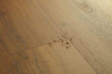 View of Botanic Caramel Oak AVMPU40315 luxury vinyl tile by Quick-Step Livyn