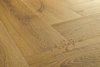 View of Botanic Smoked Oak AVHBU40363 luxury vinyl tile by Quick-Step Livyn