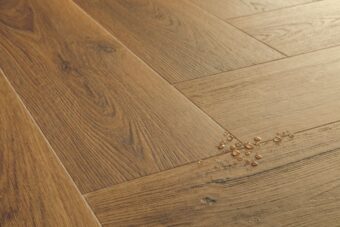 View of Botanic Caramel Oak AVHBU40364 luxury vinyl tile by Quick-Step Livyn