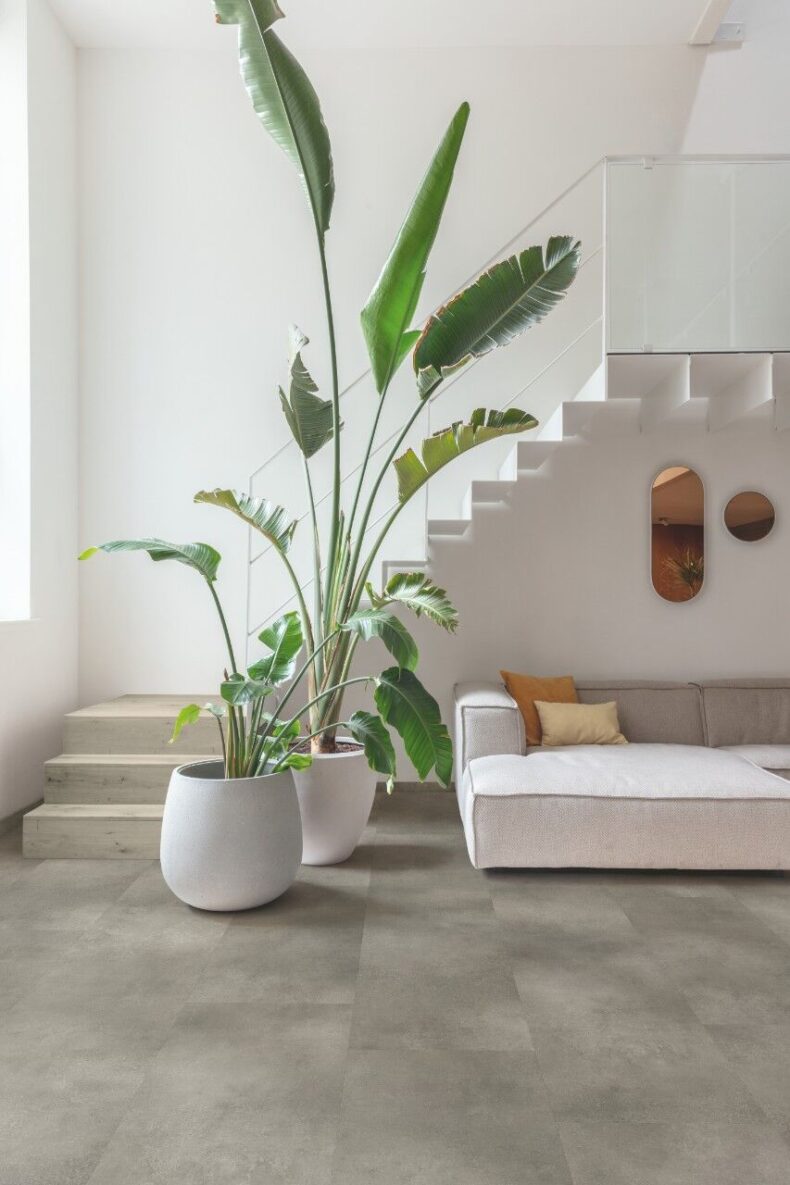 View of Cloudy Concrete AVMTU40273 luxury vinyl tile by Quick-Step Livyn