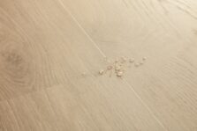 View of Coast Oak Sand AVSPT40322 luxury vinyl tile by Quick-Step Livyn