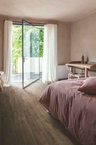 View of Autumn Oak Chocolate AVMPU40199 luxury vinyl tile by Quick-Step Livyn