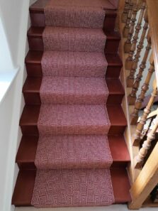 Jacquard Escargot Red stair runner by Hartley