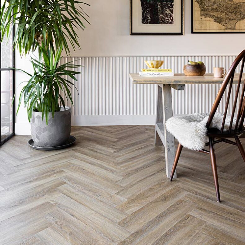 View of Flaxen Oak Herringbone luxury vinyl tile by Harvey Maria