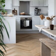 View of Rattan Herringbone luxury vinyl tile by Harvey Maria