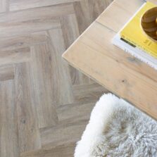 View of Flaxen Oak Herringbone luxury vinyl tile by Harvey Maria