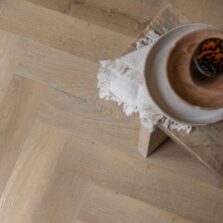 View of Rattan Herringbone luxury vinyl tile by Harvey Maria