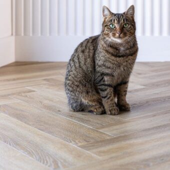 View of Flaxen Oak Herringbone luxury vinyl tile by Harvey Maria