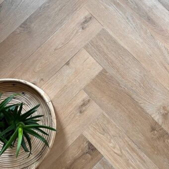 View of Rattan Herringbone luxury vinyl tile by Harvey Maria