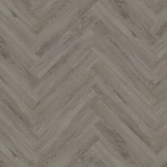 View of Flint Grey 5076201 (Universal 55 Herringbone) luxury vinyl tile by Victoria Design Floors