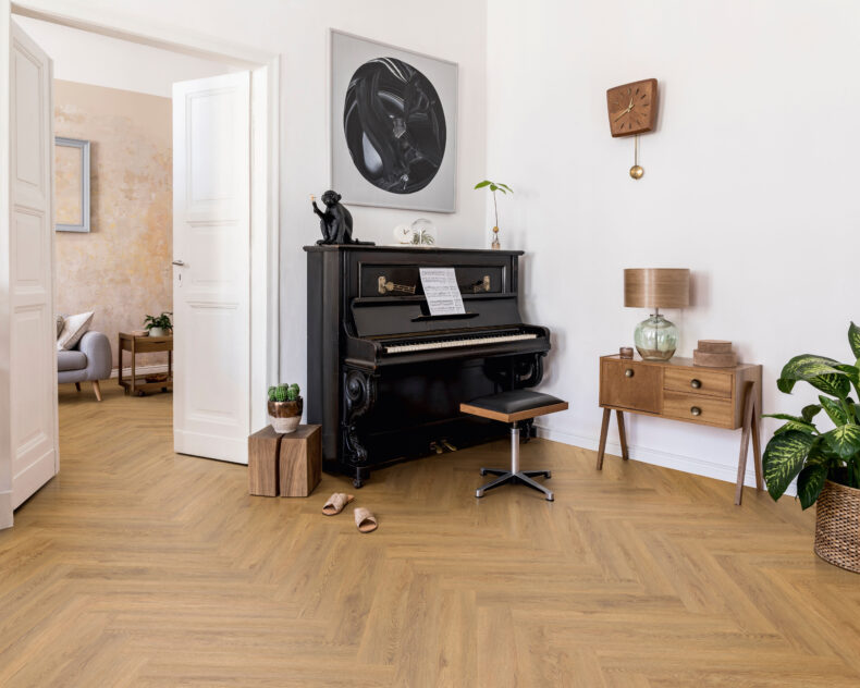 View of Almond Buff 5076215 (Universal 55 Herringbone) luxury vinyl tile by Victoria Design Floors